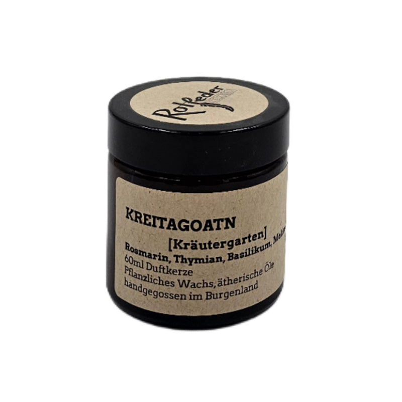 Braunes Glas mit Duftkerze, Etikett mit Aufschrift Kreitagotn und Kräuter-Düften.