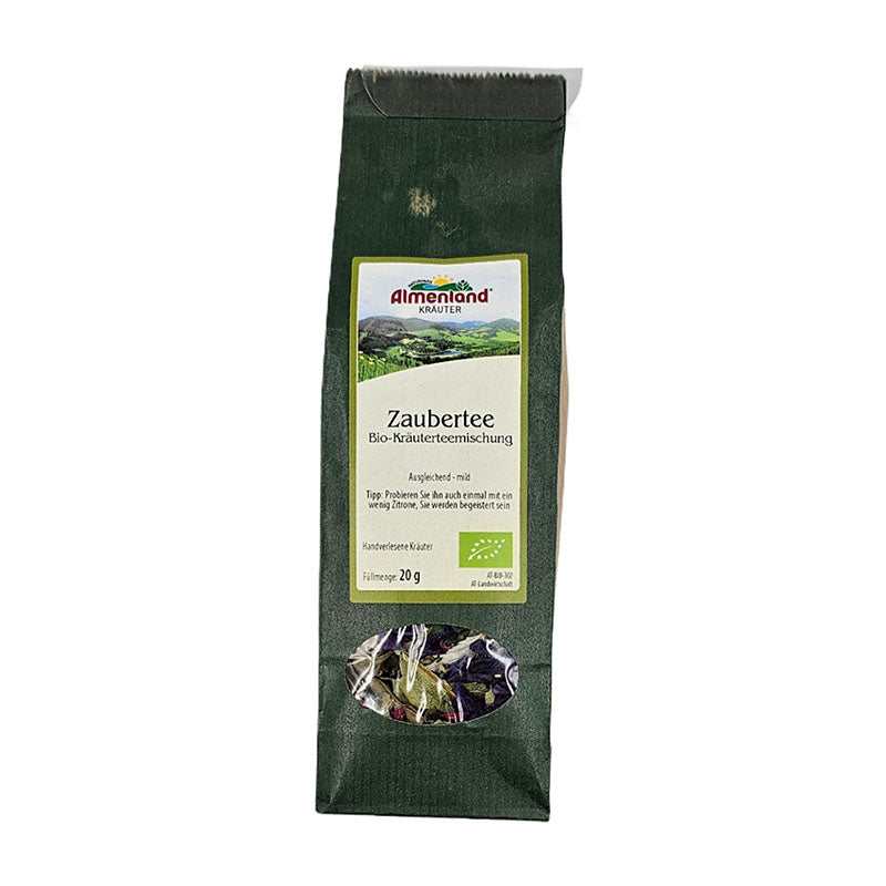 Packung Zaubertee Bio-Kräuterteemischung von Almenland Kräuter, grüne Verpackung mit Sichtfenster.