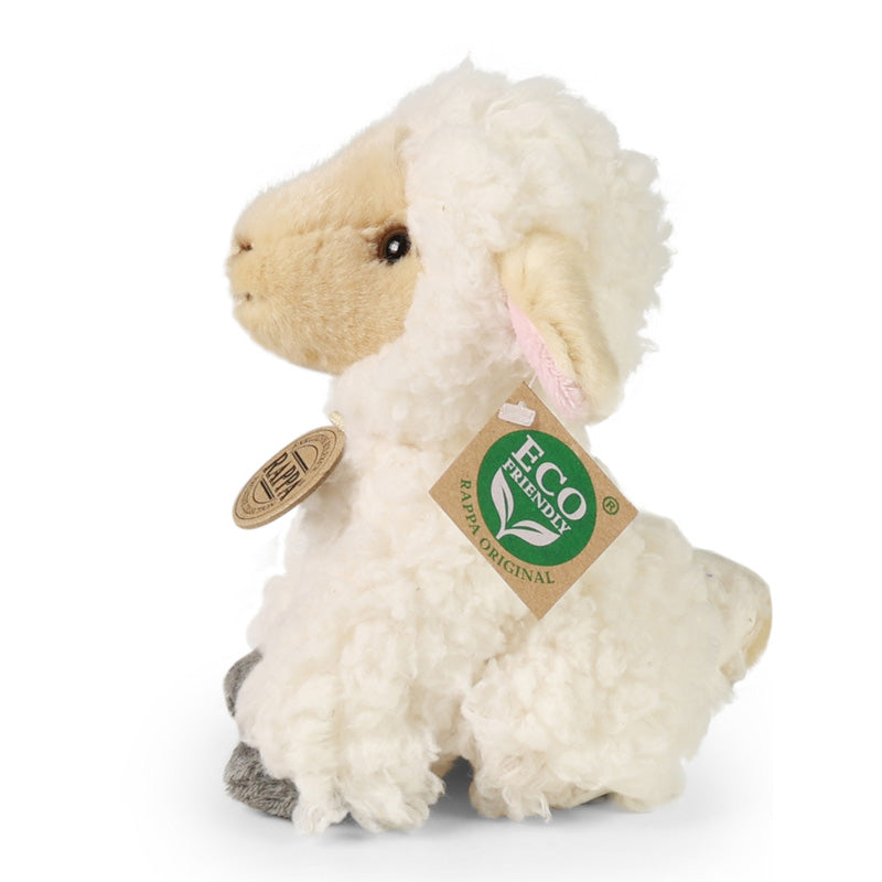 Seitenansicht des weißen Stofftier-Schafs mit braunem Gesicht, lockigem Fell und grauen Pfoten.