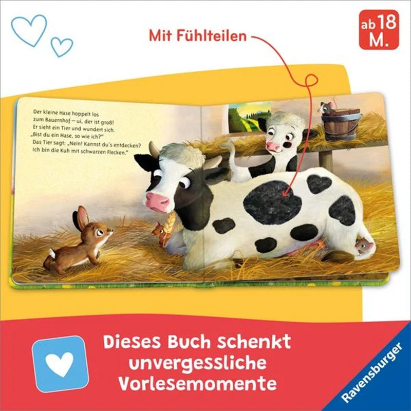 Buchseite mit Hase und liegender Kuh im Stall, großes Fühlfeld auf dem Kuhfell.