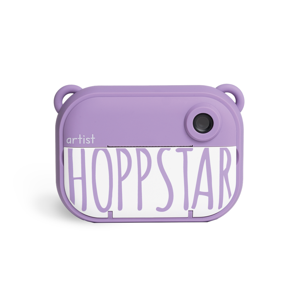 Hoppstar Artist Kinderkamera Blossom in lila – kreative Sofortbildkamera für kleine Fotografen, erhältlich im Waldpark Hochreiter Shop.