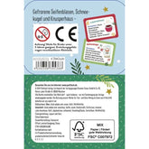 Rückseite der Dose mit CE-Kennzeichen, Herstellerinfos und Beispielen wie „Gefrorene Seifenblasen“, „Schneekugel“ und „Knusperhaus“.