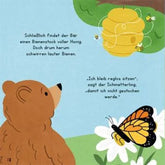 Buchseite aus „Der Yoga-Bär“ mit Geschichte und Illustration von Bär, Bienenstock und Schmetterling.