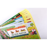 Buchrückseite bzw. Buchansicht seitlich. Mehrere stabile Pappseiten sind aufgefächert sichtbar.