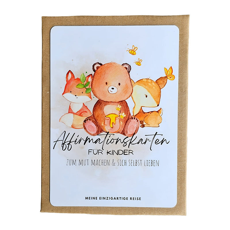 Verpackung der „Affirmationskarten für Kinder“ von Meine Einzigartige Reise. Auf der Vorderseite sind liebevoll illustrierte Tiere – ein Bär, ein Fuchs und ein Reh – vor hellem Hintergrund zu sehen.