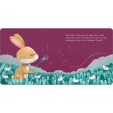 Illustration eines kleinen Hasen, der entspannt eine Pusteblume anbläst, während Samen in die Luft fliegen.