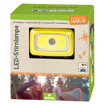 Verpackung der LED-Stirnlampe „Expedition Natur“ in Grün mit Sichtfenster, durch das die gelbe Lampe sichtbar ist
