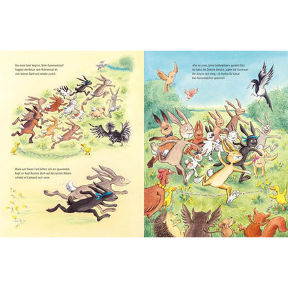 Buchseite aus „Lilly Osterhase“, auf der viele Hasen bei einem schnellen Rennen über eine Frühlingswiese laufen.