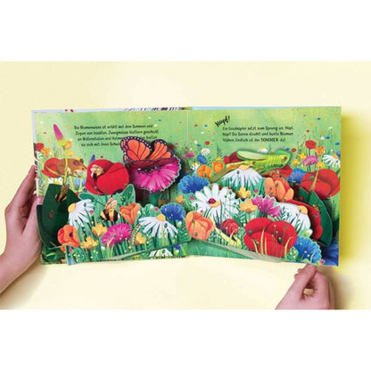 Detailansicht Pop-up-Seite. Farbenfrohe Sommerwiese mit beeindruckenden Pop-up-Blumen.