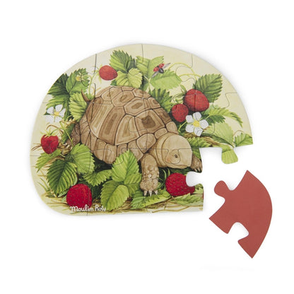 Zusammengebautes Mini Puzzle mit Schildkröte und Himbeeren