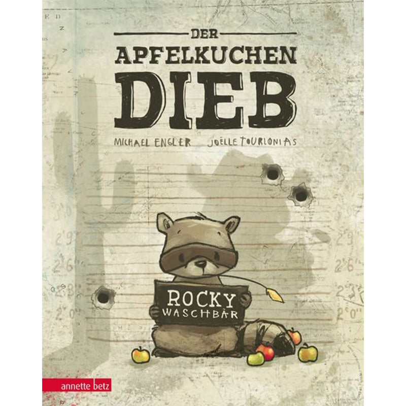 Buchcover: Titel „Der Apfelkuchendieb“, ein Waschbär hält ein Schild mit der Aufschrift „Rocky Waschbär“, Einschusslöcher im Hintergrund.