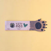 Verpackung der Tattoos von oben, im Tatzen-Design mit der Aufschrift „Tattoos“.