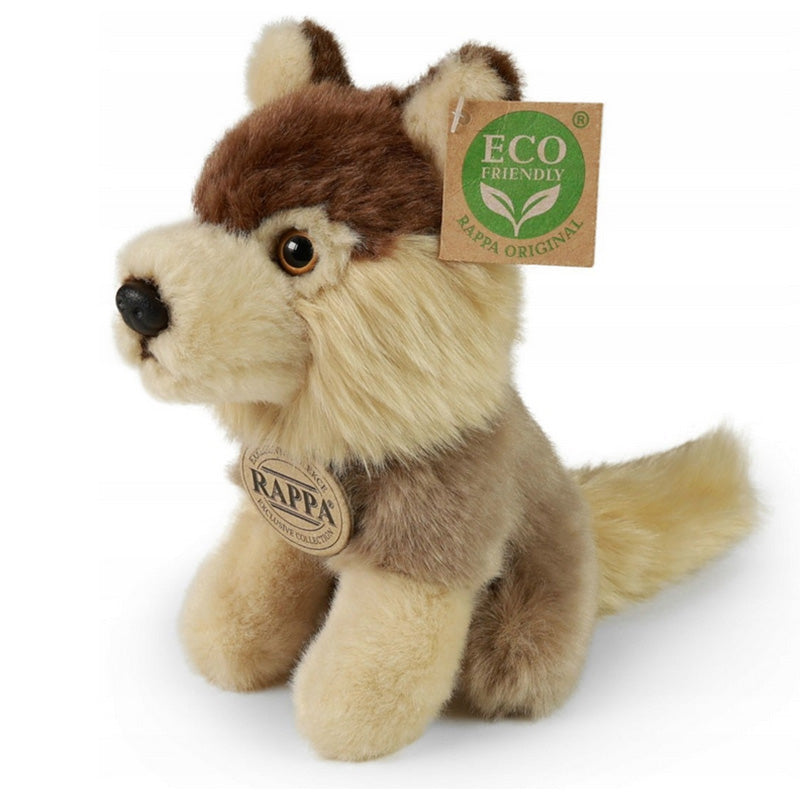 Ein Plüschwolf sitzt aufrecht, mit braunem Rücken, cremefarbenem Gesicht und Beinen sowie buschigem Schwanz. Am Ohr hängt ein „Eco Friendly“-Etikett.