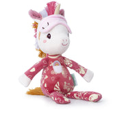 Plüsch-Einhorn mit rosa Schlafmaske und gemustertem rosaroten Schlafanzug, sitzt seitlich.