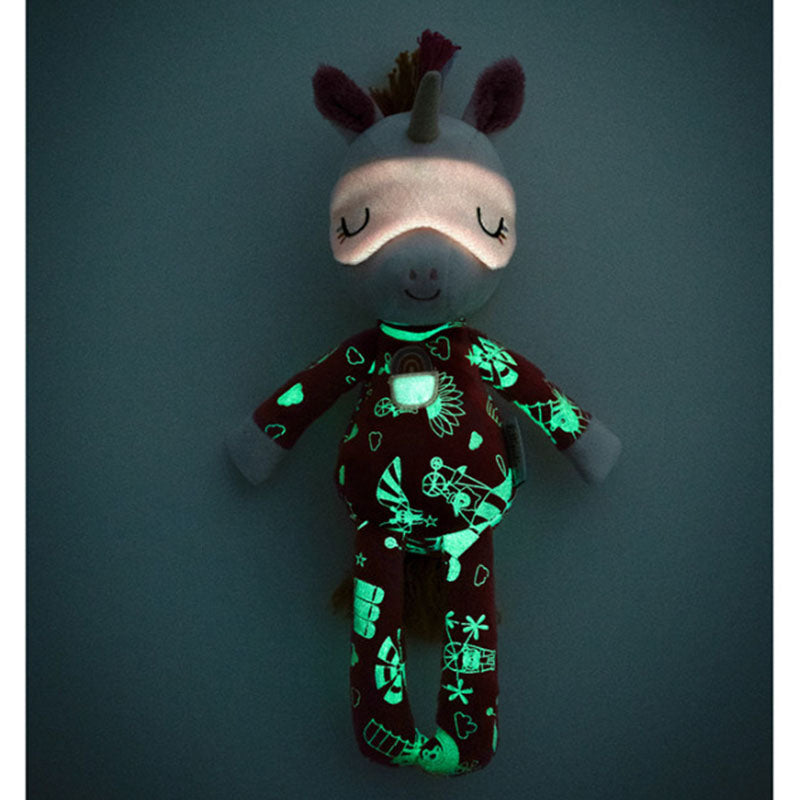 Leuchtendes Plüsch-Einhorn im Dunkeln mit glow-in-the-dark-Muster und schimmernder Schlafmaske.