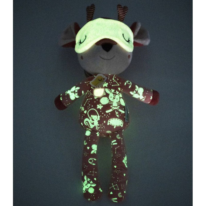 Leuchtendes Plüschreh im Dunkeln, Muster und Schlafmaske fluoreszieren